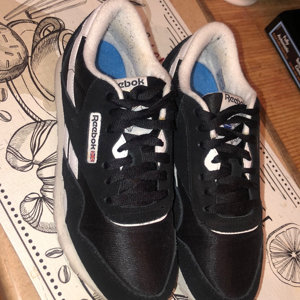 Black and white Reebok sneakers